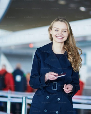 Woman smiling while holding a mobile phone