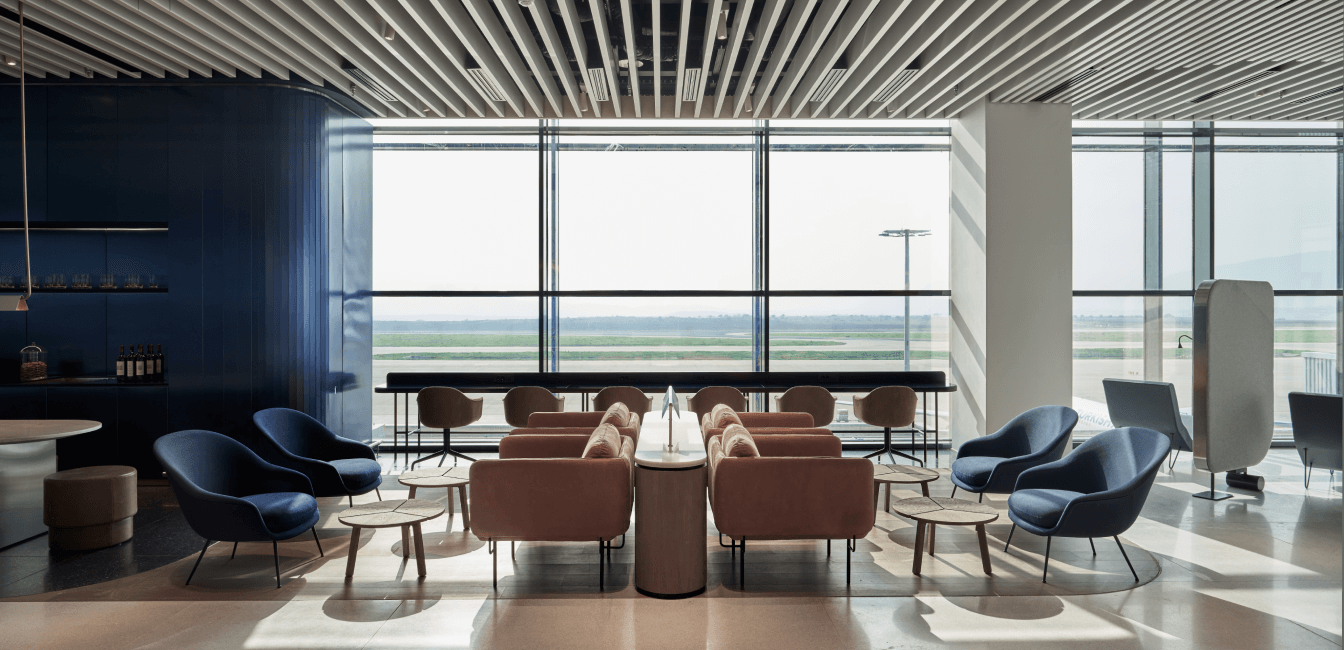 Business lounge area, chairs and windows with airport view