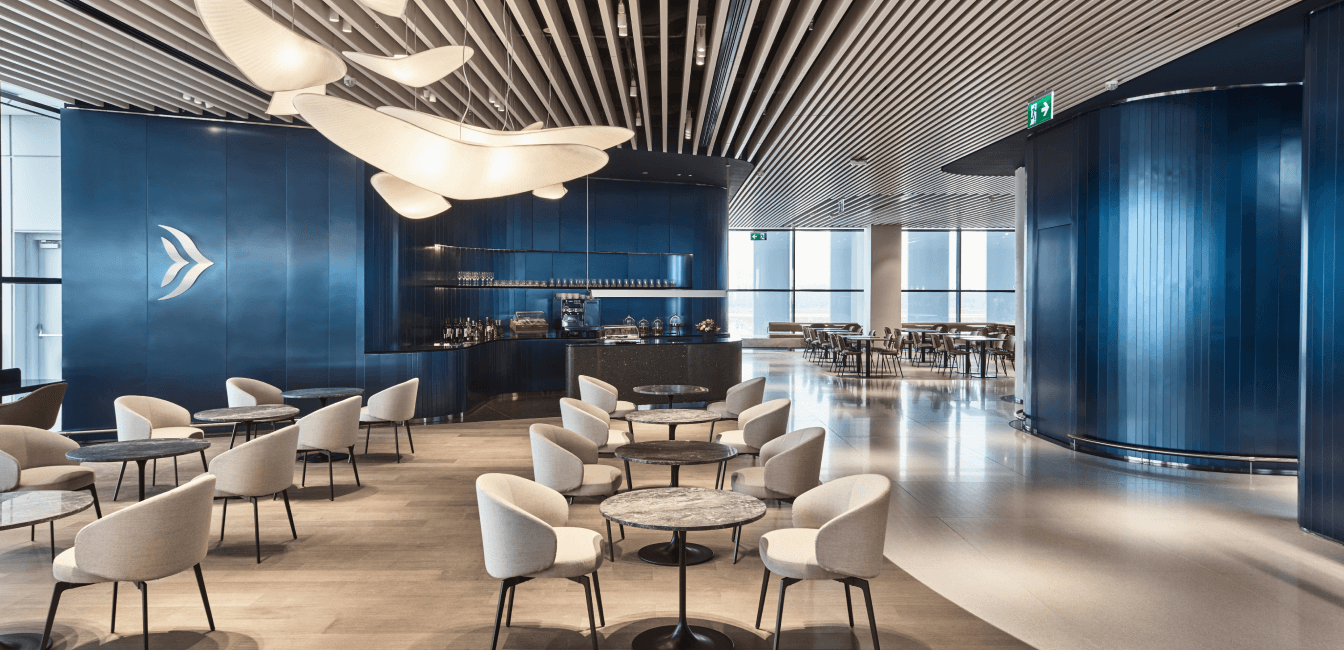 Business lounge area with chairs and bar