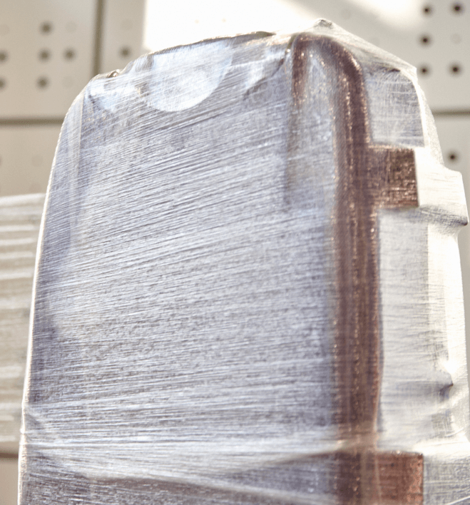 Suitcase wrapped in protective plastic